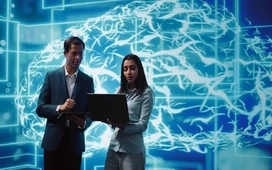 Business professionals analysing AI data on a laptop – trends and opportunities driving the rise of AI in business