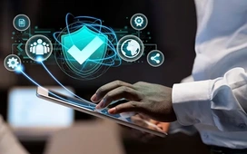 Hands using tablet with AI security shield overlay – how AI enhances digital safety and protection today