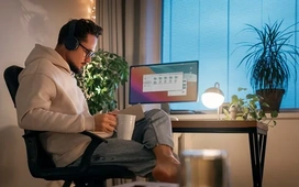 Freelancer working remotely from a home office with laptop and headphones – tips for finding remote freelance jobs