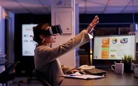 Professional using VR headset at desk – explore remote opportunities that fit your lifestyle with OHSC