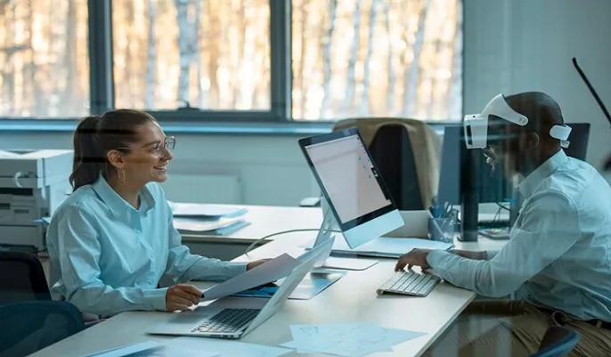 HR professionals using computers in a modern office – how AI is transforming recruitment and HR practices