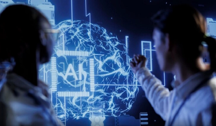 AI SkillsTwo professionals analyzing a digital AI brain interface, illustrating the importance of AI skills for future careers and modern workplace innovation.