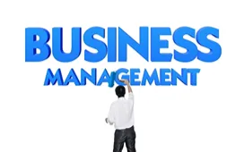 Business professional standing before large “Business Management” text, symbolising leadership, growth, and management studies.