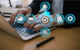 Hands typing on laptop with efficiency icons, representing Lean Six Sigma process improvement for businesses.