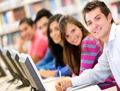 Group of students studying at computers in a classroom, representing flexible and accessible online certificate courses.