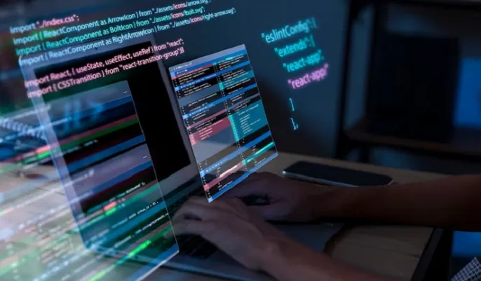 Programmer typing code on laptop screens – beginner-friendly guide to learning and mastering Python language.