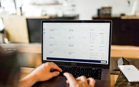 Accountant working remotely on a laptop with financial dashboard, representing remote accounting careers and online finance jobs.