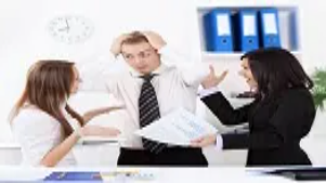 Business professionals in a tense discussion, illustrating high-pressure problem solving and advanced crisis management strategies in the workplace.