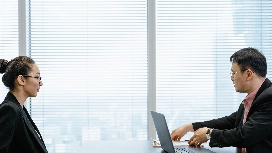 Candidate and interviewer discussing career opportunities while learning how to prepare for a successful job interview
