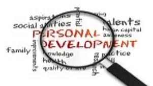 Magnifying glass highlighting the words ‘personal development’, symbolizing growth, self-improvement and advanced life coaching principles.