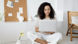 Young professional working on a laptop at home – study AI for inventory management and stock control online with OHSC