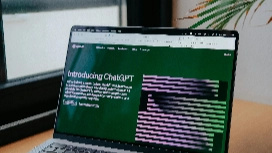 Laptop displaying AI design tools and ChatGPT interface – learn AI room design with OHSC short course.
