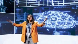 Confident presenter standing before a digital AI brain graphic, illustrating communication and leadership skills in AI-driven environments.