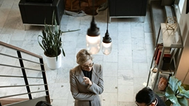 Business professionals discussing ideas in a modern office, representing innovation and digital transformation powered by AI technologies in business.