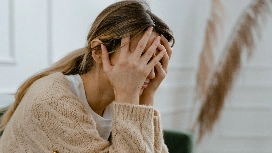 Person showing signs of anxiety and emotional distress, illustrating depression awareness and mental health challenges