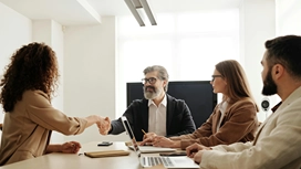 Business professionals meeting and shaking hands, symbolizing collaboration, innovation and decision-making enhanced by artificial intelligence in business.