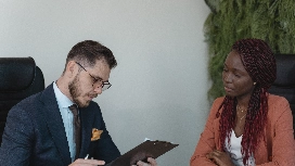 Candidate participating in a competency-based interview discussing skills, experience and behavioural responses