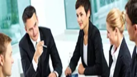 Business team in a meeting discussing strategies, representing essential managerial, leadership and organisational skills in business management