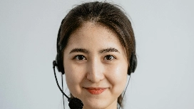 Friendly customer service agent wearing headset – develop communication skills with OHSC short course online