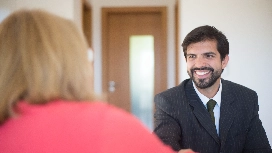 Confident job candidate engaging with an interviewer while developing self-confidence and interview success skills