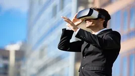 A professional using a VR headset outdoors, symbolizing how AI and immersive tools can boost confidence, adaptability, and personal growth.