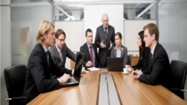 Business professionals discussing solutions in a meeting, illustrating conflict resolution, negotiation and communication skills