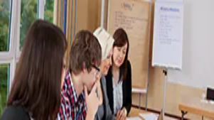 Team members reviewing notes and strategies during a meeting, representing crisis response, problem-solving, and effective crisis management planning.