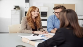 Professionals discussing solutions in a business meeting, demonstrating critical thinking and problem-solving skills in the workplace.