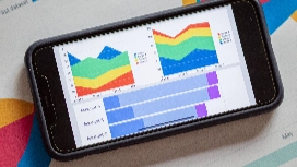 Colourful data visualisation charts displayed on a mobile dashboard, illustrating reporting and analytics tools