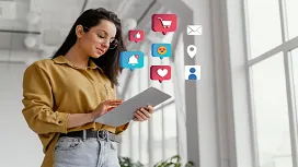 Woman using a tablet with digital marketing icons like likes, messages, and shopping carts, showcasing beginner-level digital marketing concepts.