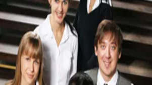 A diverse group of people smiling on a staircase, symbolizing inclusion, awareness, and supportive environments in disability awareness training.