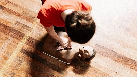 Person performing CPR on a first aid training mannequin during a beginner first aid and CPR certification course
