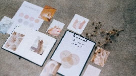 Freelance marketing and personal branding materials displayed on a workspace, showcasing strategies for freelance career growth