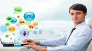 A marketer works on a laptop with colorful digital icons representing online advertising, illustrating Google Ads campaign creation and PPC marketing skills.