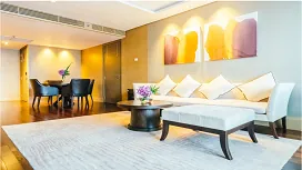 Bright modern living room with elegant furniture, wall art and soft lighting, representing the Level 1 Certificate in Interior Design course.