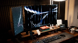 Modern workstation with keyboard and monitors, representing beginner keyboarding skills and workplace productivity