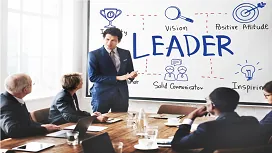 Business leader presenting leadership concepts to a professional team, illustrating advanced skills taught in the Level 5 Leadership and Management diploma.