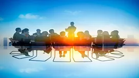 Silhouette of a leader addressing a seated team against a sunrise backdrop, symbolizing vision, communication, and teamwork in Level 4 people management training.