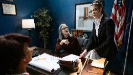 Business professionals discussing strategy in an office setting, representing business management diploma and online training programs