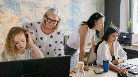 Manager using an AI workforce dashboard to track performance and schedules, representing OHSC’s free Workforce Management with AI course.