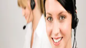 Two customer service professionals wearing headsets, representing communication, teamwork, and virtual workplace management skills.