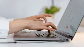 Professional working on a laptop from home, learning remote data entry careers and data entry positions from home – OHSC
