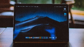 Laptop on desk with dark screen for online learning – study remotely with OHSC professional courses