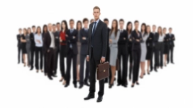 Confident professional leading a team, illustrating self-belief, overcoming self-doubt and building confidence skills