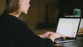 Remote accountancy student working on laptop from home – free online accountancy bootcamp career course with OHSC