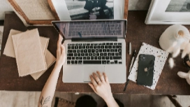 Remote worker typing on laptop at home desk – build accuracy with OHSC remote data entry free course online