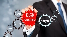 Business professional highlighting risk management concepts with gears showing control, reduce, mitigate and avoid strategies