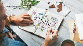 Person practicing self-reflection and confidence-building exercises – learn how to improve self-esteem and personal development online