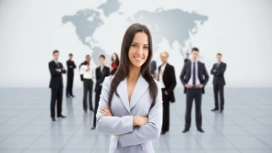 Confident professional standing with a team, illustrating self-esteem, personal growth and confidence development skills