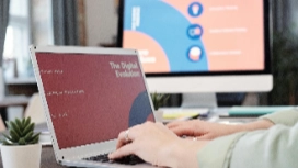 Hands using a laptop with social media analytics on screen, promoting skills from OHSC Social Media Marketing short course